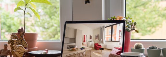 A laptop showing an image of a home interior